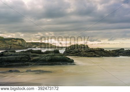 Serantes Beach Landscape With Rocks And Sea Water In Asturias, Spain