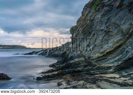 Serantes Beach Landscape With Rocks And Sea Water In Asturias, Spain