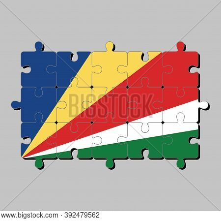 Jigsaw Puzzle Of Seychelles Flag In Five Oblique Bands Of Blue Yellow Red White And Green. Concept O
