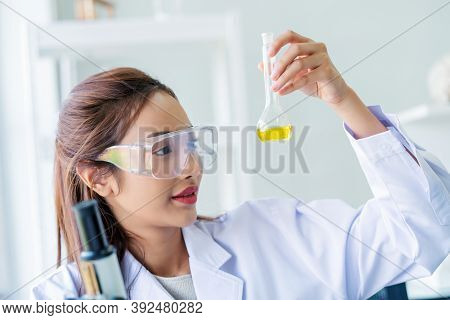 Scientist Woman Lab Technician Assistant Showing Alcohol Hand Gel For Cleaning Hands At Laboratory. 