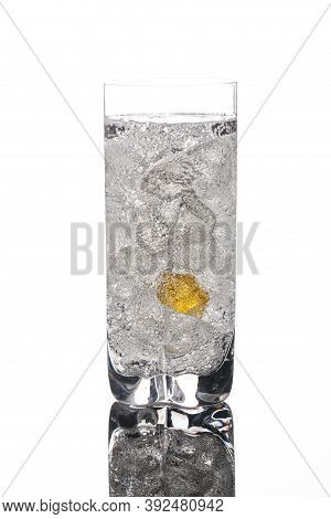Crystals Of Ice In A Glass With Water On A Glass Background