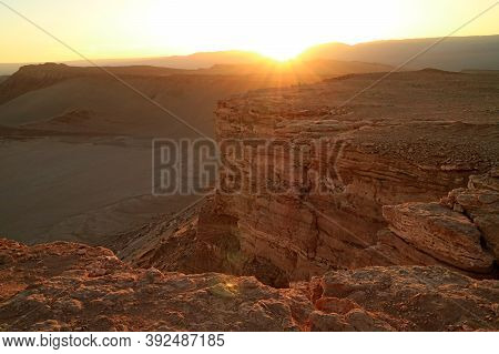 The Sun Setting On The Mountain Ranges Of Valle De La Luna Or Moon Valley In Atacama Desert, San Ped