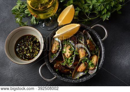 Classic French Meal Moules Marinière  Marinara Mussels With Garlic, Sauce, Lemon And Parsley.