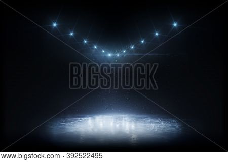 Beautiful Empty Winter Background And Empty Ice Rink With Lights. Winter Background. Spotlight Shine
