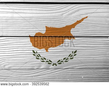 Flag Of Cyprus On Wooden Wall Background. Grunge Cyprus Flag Texture, An Outline Of The Country Of C