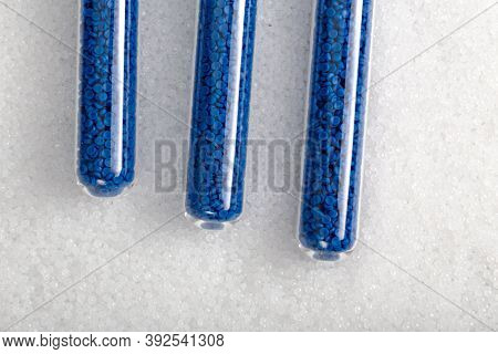 White Plastic Beads On Wood  Background, Polymers Bead Or Polymer Resin, Polymer Pallet, Product Fro