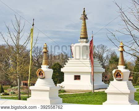 La Boulaye, France - April Circa, 2018. Several Small White Stupas With Traditional Eyes Of Buddha P