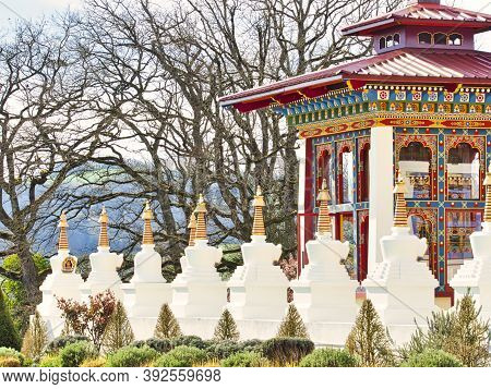 La Boulaye, France - April Circa, 2018. Several Small White Stupas With Traditional Eyes Of Buddha P