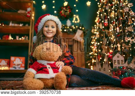 Portrait Of Cutel Little Child Girl Playing With Taddy Bear, New Year Holiday Concept.