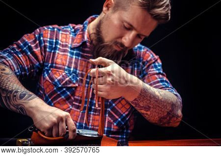 Professional Leather Worker Makes Quality Products At The Workshop