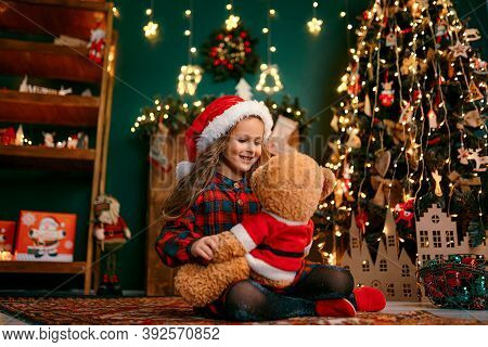 Portrait Of Cutel Little Child Girl Playing With Taddy Bear, New Year Holiday Concept.