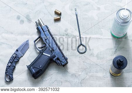 Pistol, Knife And Ramrod. View From Above.