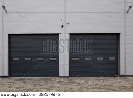 Close-up Of Automatic Metal Roller Doors Used In Factory, Warehouse, Garage And Industrial Warehouse