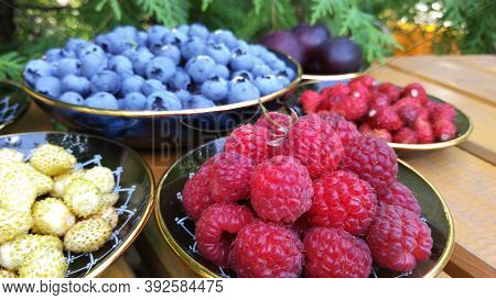 Juicy, Tasty, Fresh Berries. Raspberries, White And Red Strawberries, Blueberries And Cherry Plums. 