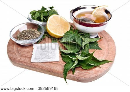 Fresh Healthy Nettle Plant, Lemon And Dried Herbs Isolated On A White Background Good For Coronaviru