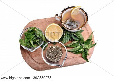 Fresh Healthy Nettle Plant, Lemon And Dried Herbs Isolated On A White Background Good For Coronaviru