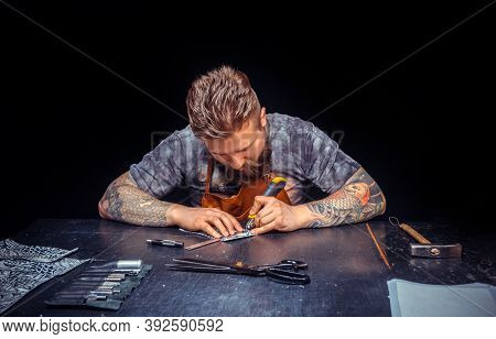 Leather Artist Produces Leather Goods In The Workshop