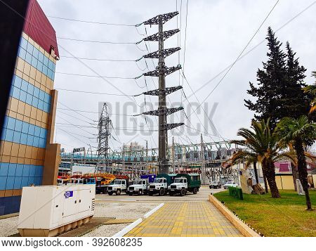 Russia, Sochi 18.02.2020. A Courtyard With Trucks Lined Up And Electric Poles. City Power Plant