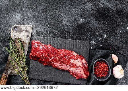 Raw Marbled Beef Steak With Pink Pepper And Thyme. Black Background. Top View. Copy Space
