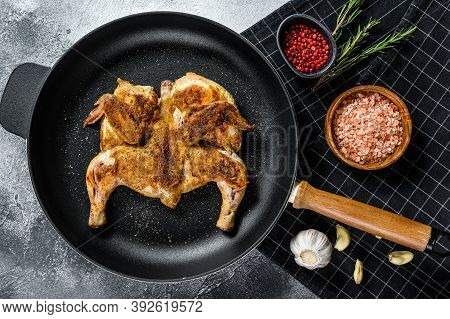 Halves Of Grilled Juicy Chicken With Golden Brown Crust In A Pan. Gray Background. Top View