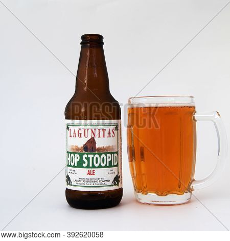 Davis, Ca.  August 16, 2020: An Open Bottle Of Lagunitas Hoppy Beer  Isolated Against A White Backgr