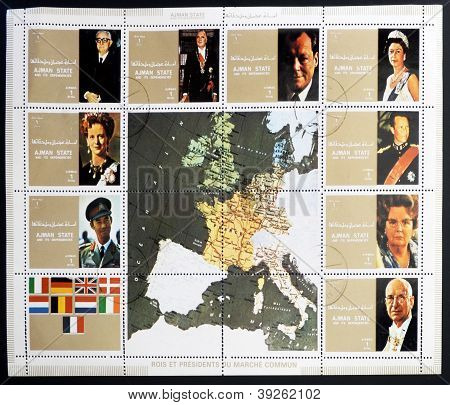 AJMAN - CIRCA 1972: En samling av frimärken tryckt i Ajman visar bilder av kungar och presidera