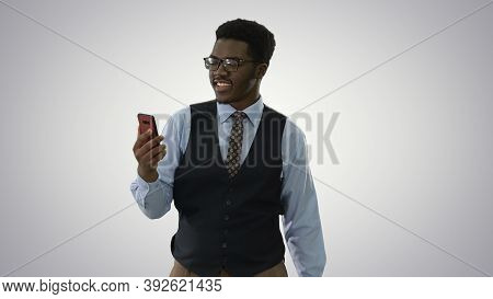 Smiling African American Businessman Making Video Call Holding M