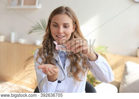 Medical Specialist Disinfecting Hands With Hand Rub Antiseptic.
