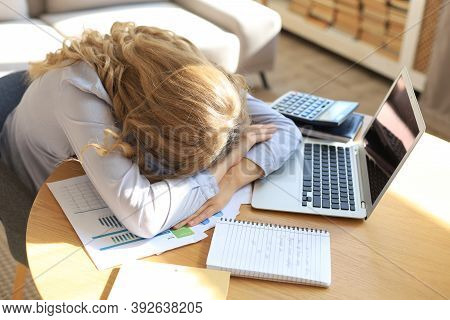 Tired Overworked Woman Resting While She Was Working On Laptop.