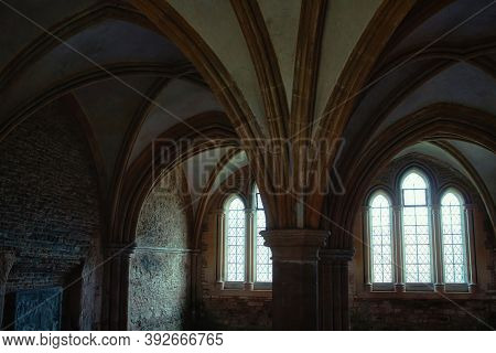 Lacock, England - March 01 2020: Shot Of Of Dark, Spooky Room In The Cloisters At Lacock Abbey