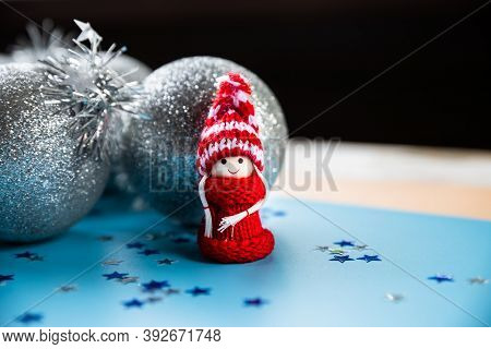 Christmas Composition With Gnome Or Swedish Tomte, On A Blue Background, Copy Space, Top View.wooden