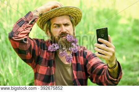 Cowboy Hipster In Field With Smartphone. Social Networks. Video Call. Internet Available In Most Rem