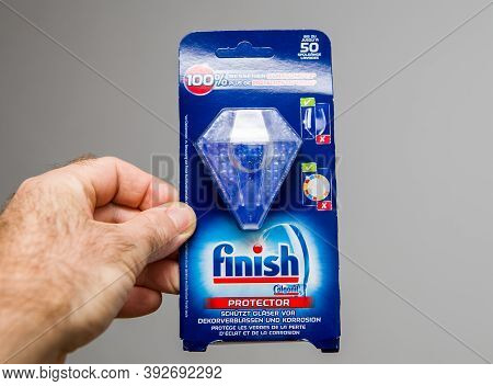 Paris, France - Oct 20, 2020: Pov Male Hand Holding New Finish Protector For The Dishwasher Mashine 