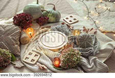 Autumn Composition Of Pumpkins, Hydrangea Flowers, Home Decor Details With Candles And A Gerland On 