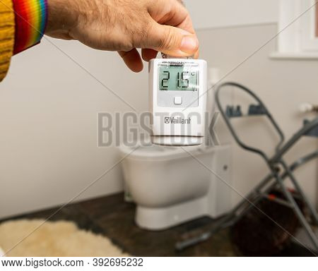 Paris, France - Oct 25, 2020: Man Hand Holding New Vaillant Ambisense Vr50 Thermostatic Valve Connec