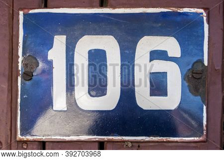 Weathered Grunge Square Metal Enameled Plate Of Number Of Street Address With Number 106
