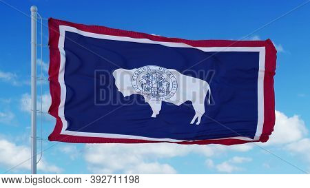 Wyoming Flag On A Flagpole Waving In The Wind, Blue Sky Background. 3d Rendering