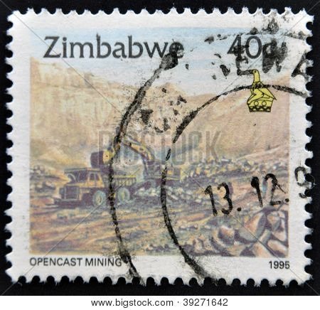 ZIMBABWE - CIRCA 1995: A stamp printed in Zimbabwe shows excavation opencast mining circa 1995