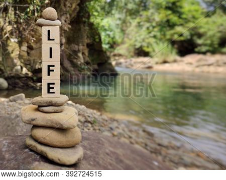Inspirational And Motivational Concept - Life Word On Wooden Blocks Background. Stock Photo.