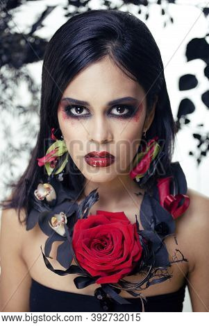 Pretty Brunette Woman With Rose Jewelry, Black And Red, Bright Make Up Kike A Vampire Closeup Red Li