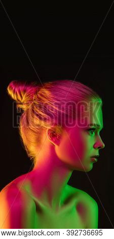 Mavelous. Portrait Of Fashion Model In Neon Light On Dark Studio Background. Beautiful Caucasian Wom