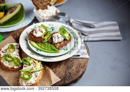 Sandwiches With Soft Cheese, Avocado And Cucumber. Breakfast Is On The Table. Healthy Food. Toast An