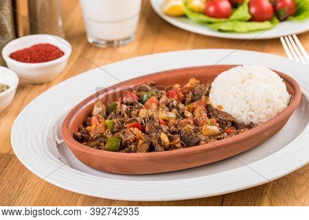 Turkish Meat Casserole And Rice On Wooden Table.