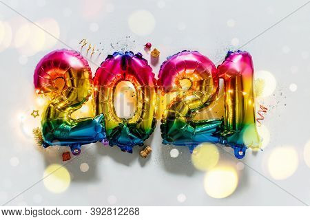 Rainbow colored Foil balloons in the form of numbers 2021. New year celebration