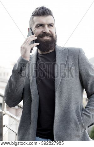 Share Information By Verbal Communication. Bearded Man Has Business Talks On Smartphone. Business Co