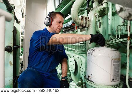 Marine Engineer Officer Controlling Vessel Enginesand Propulsion In Engine Control Room Ecr
