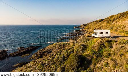 Spanish Rocky Coastline With Camper Car Camping On Cliff Sea Shore. Mediterranean Region Of Villaric
