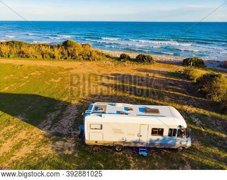 Coastal Landscape With Caravan Wild Camping On Beach Sea Shore. Mediterranean Coast Of Spain. Holida
