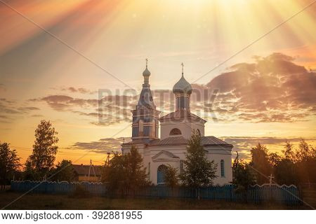 Orthodox Old Church In The Village At Sunset