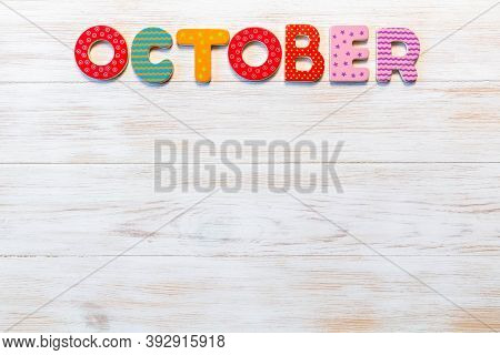 Wooden Letters Written October Month On Vintage Background. Inscription October With Copy Space. Top